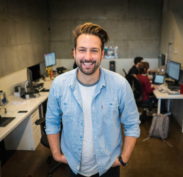 man in office smiling