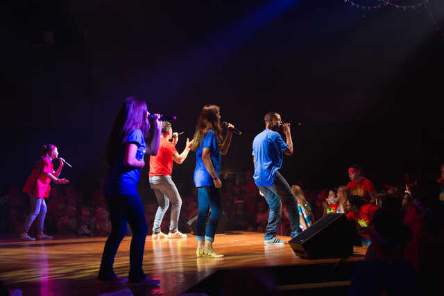 Image of Kidstuf event, singers on stage