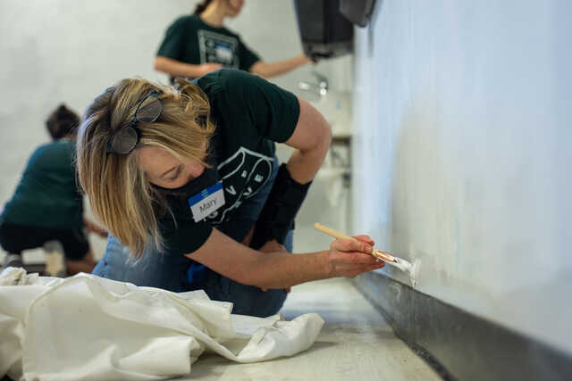 woman painting at a nonprofit