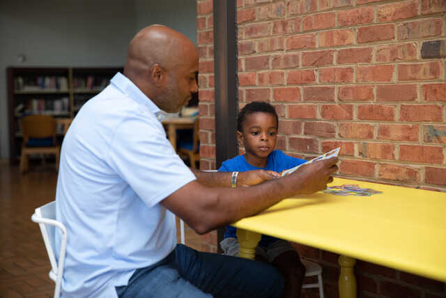 man mentoring a child